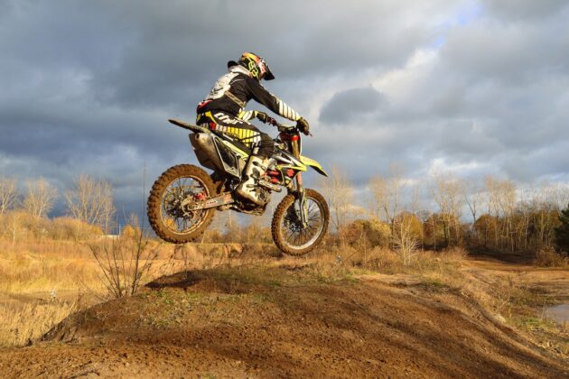 Motocross Rider on His Dirt Bike during Daytime 630x420